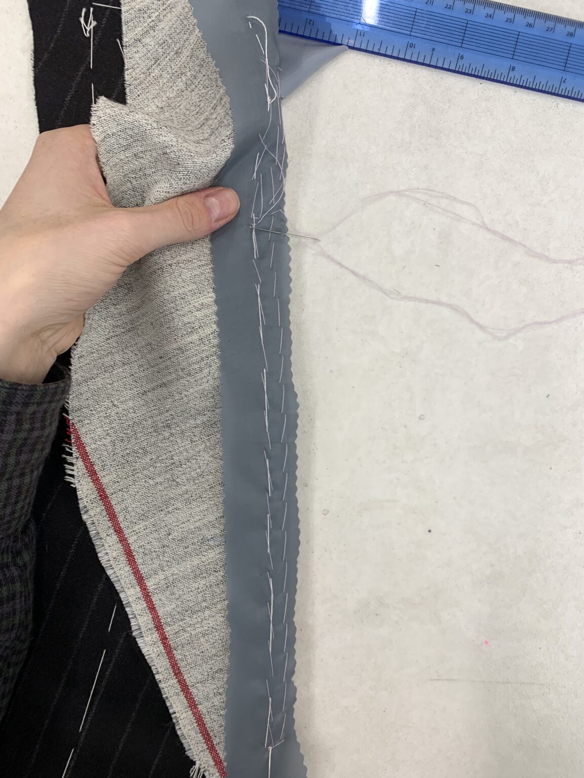Pad stitching bridle onto lapel roll