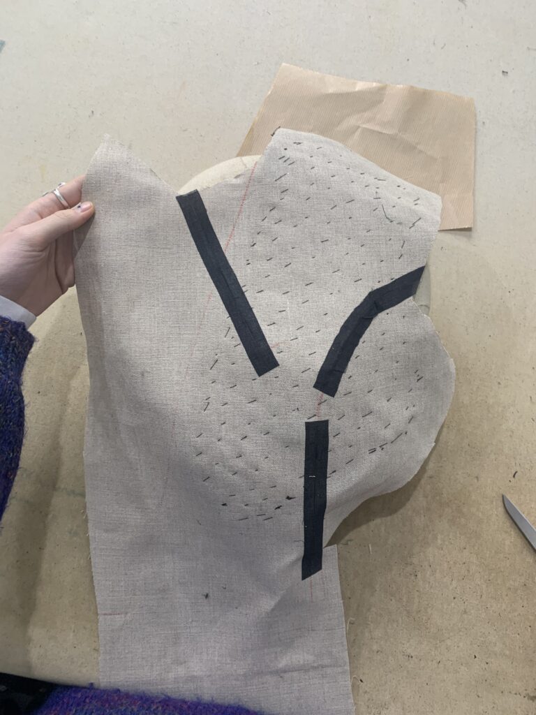 Stabilising darts with fusible tape