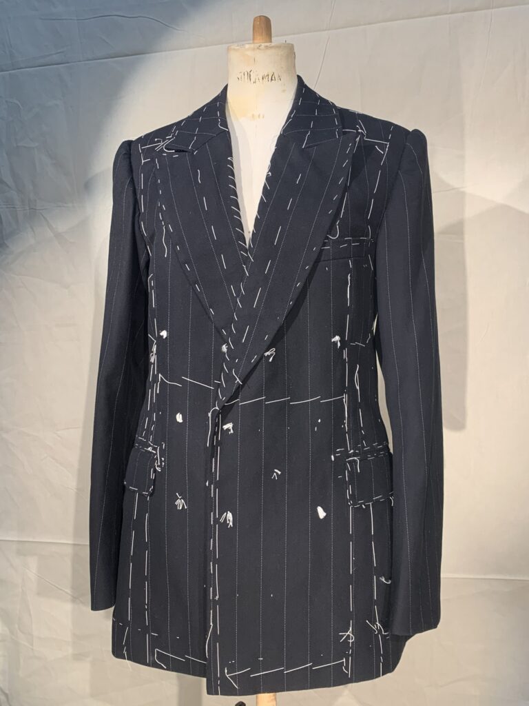 Finished suit before removing tailors tacks