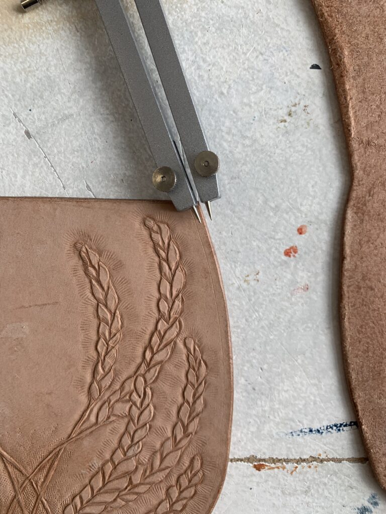 Lightly marking the edge to punch stitching holes