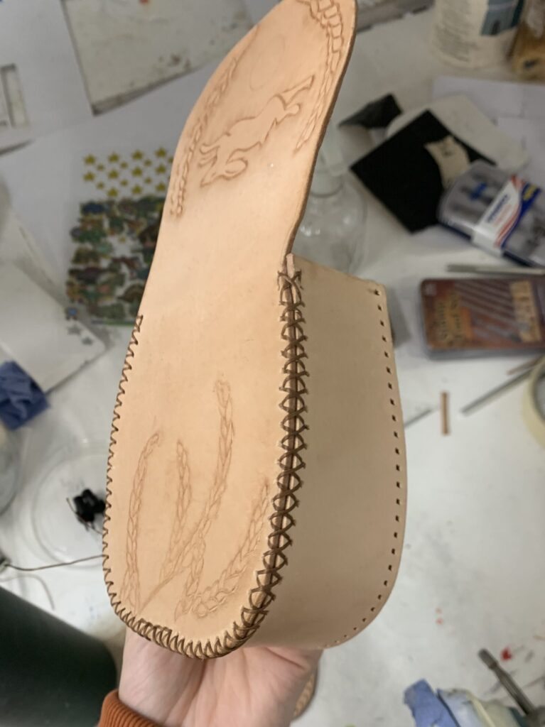 I didn't have the right tool to make a 45 degree angle hole so thought the cross stitching would also help hold the pieces in place